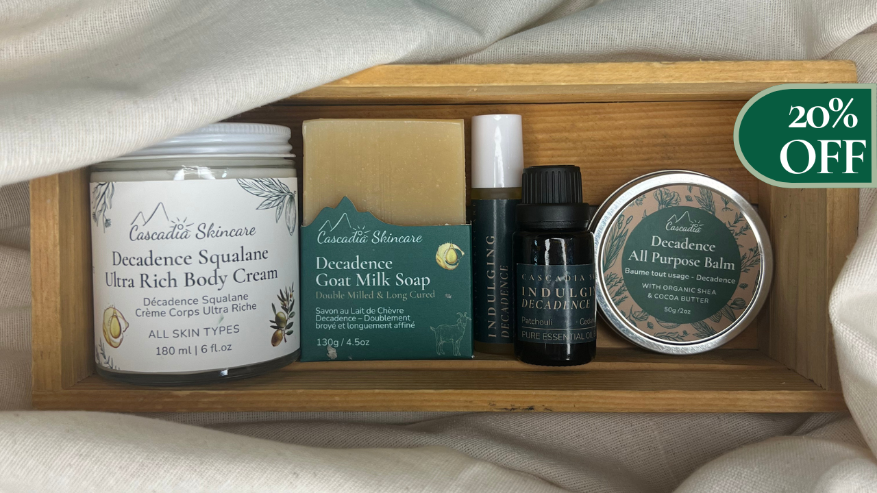 Cosmetic products including a cream, soap, and balms in a wooden box with a '20% OFF' label.
